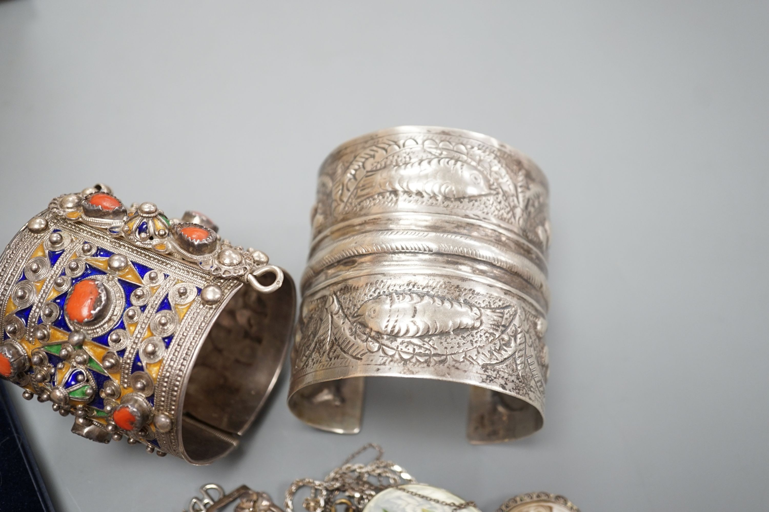 A 1950's box and a quantity of assorted costume jewellery, including continental bangles, etc.